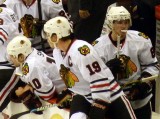 Jonathan Toews, Patrick Sharp, and Patrick Kane on the Chicago Blackhawks bench. Image Courtesy of Wikipedia Commons.